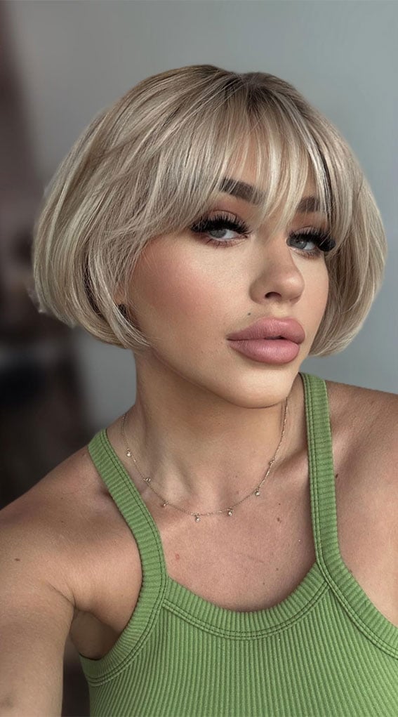 Platinum Blonde Bob With Wispy Bangs Platinum Blonde Bob With Wispy Bangs — Classy French Bob with Bangs