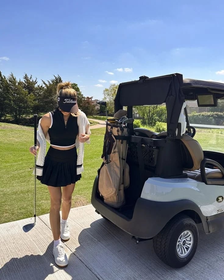 Black Crop Top, Cardigan, and Pleated Skirt Golf Look Black Crop Top, Cardigan, and Pleated Skirt Golf Look — Classy Golf Outfits