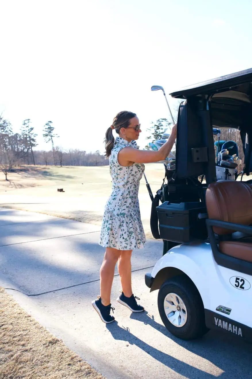 Floral Print Golf Dress with Navy Sneakers and She Wears Sunglasses Floral Print Golf Dress with Navy Sneakers and She Wears Sunglasses — Classy Golf Outfits