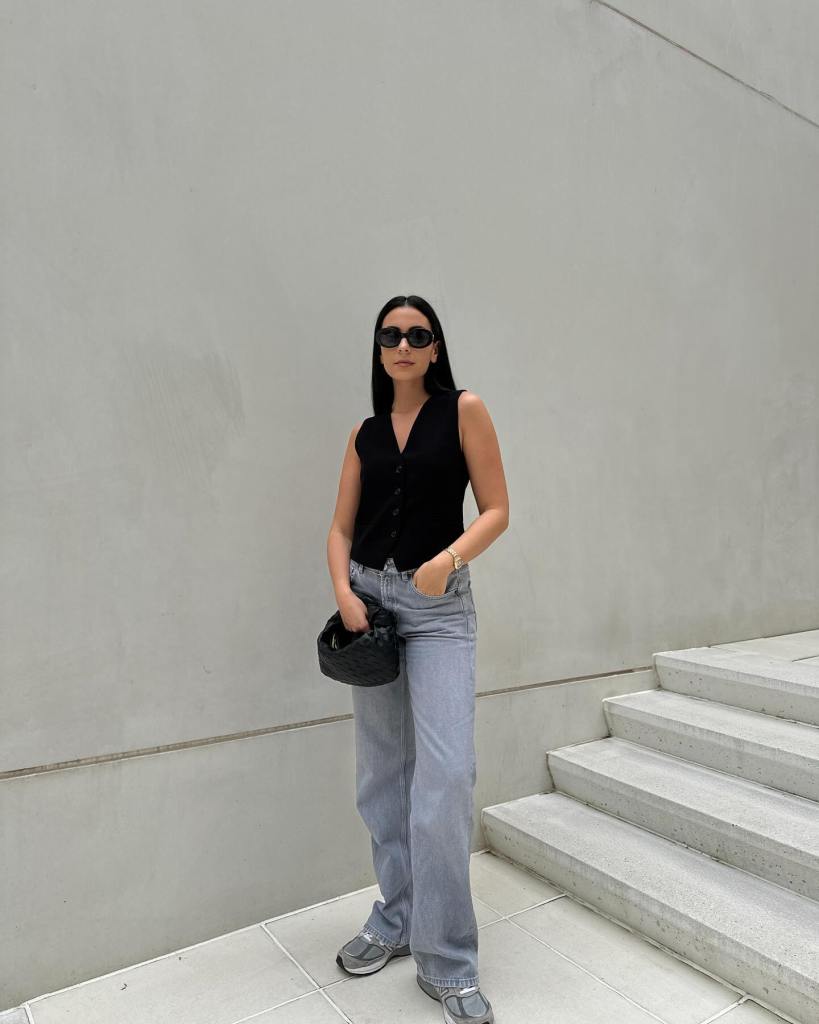 Sleeveless Vest Adds Layering to Light Grey Jeans — Classy Gray Jeans Outfits