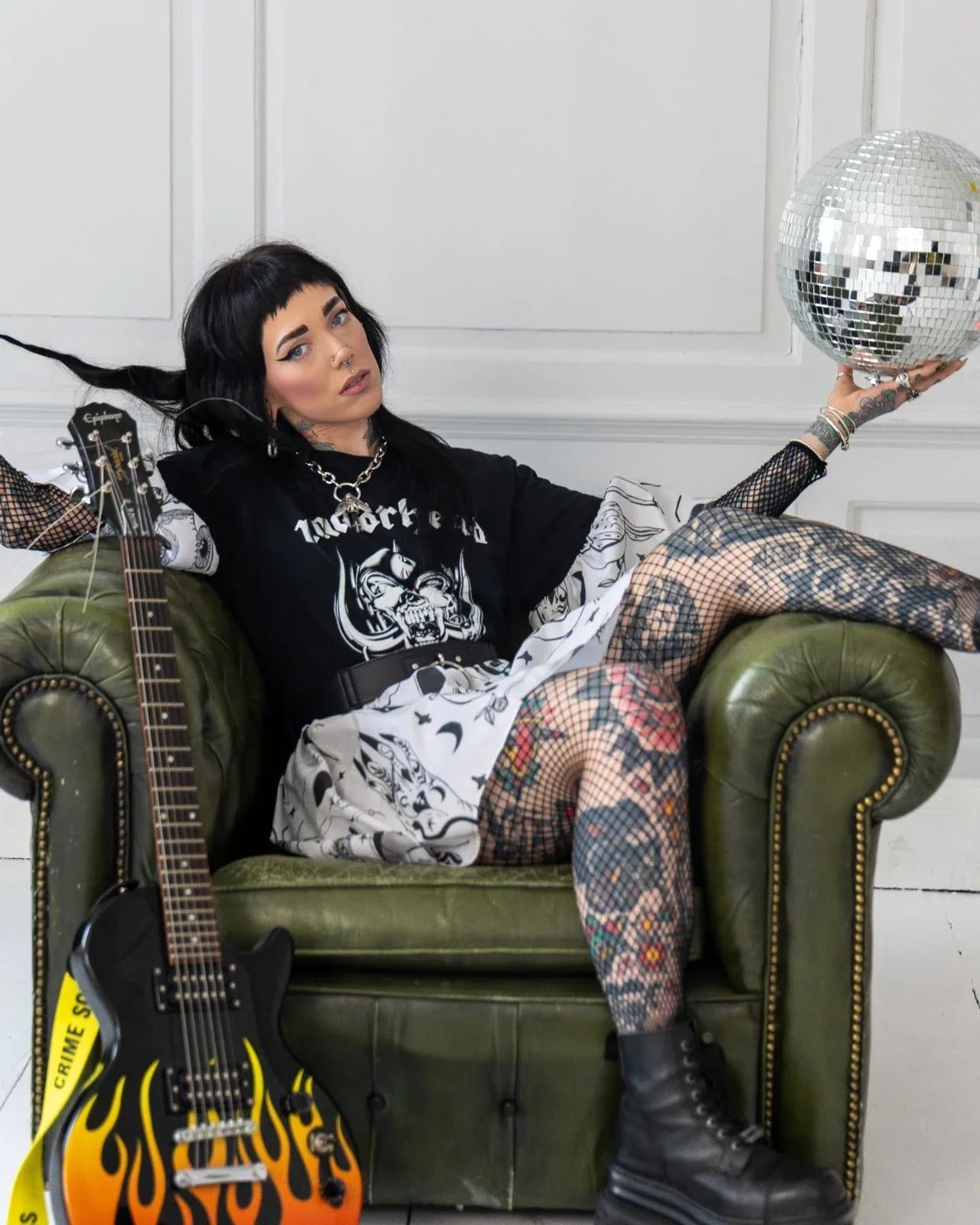 Fishnet Top Under Graphic Tee with Mini Skirt Fishnet Top Under Graphic Tee with Mini Skirt — Classy Grunge Style
