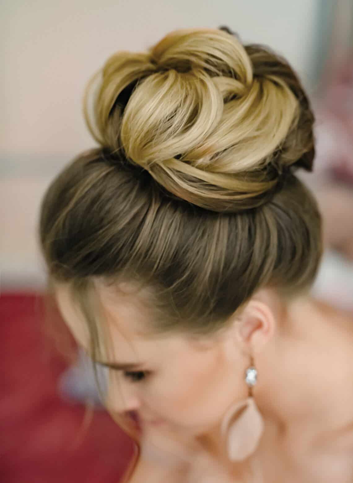 Voluminous High Bun With Curls and Blonde And Brown Highlights — Classy Hairstyles Pictures