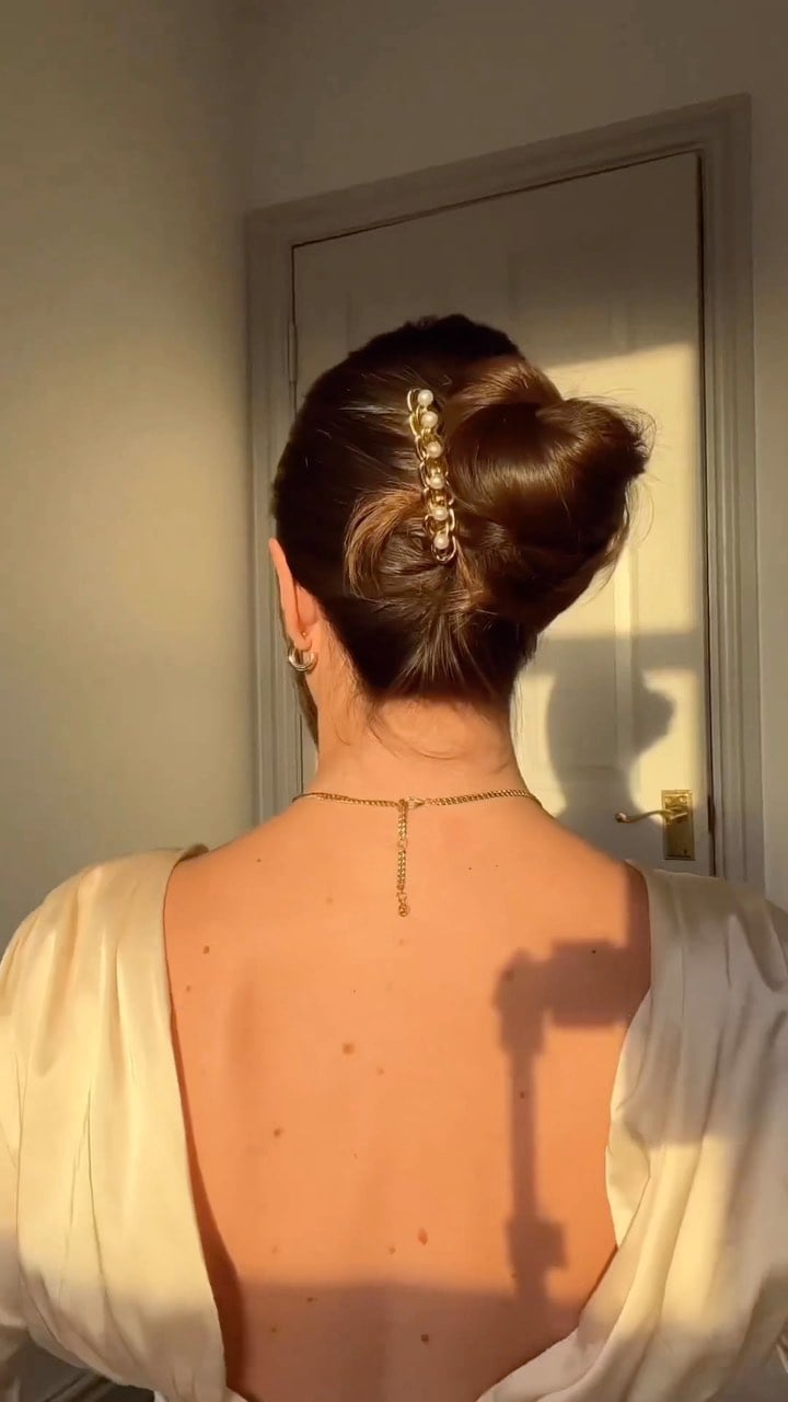 Elegant Updo Bun With Decorative Clip — Classy Hiking Hairstyles