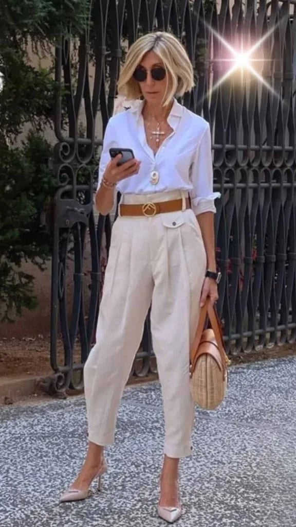 Cream High-Waisted Pleated Trousers with Oversized White Shirt Cream High-Waisted Pleated Trousers with Oversized White Shirt — Classy Italian Style