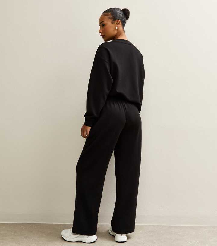 Monochromatic Black Joggers And Sweatshirt — Classy Joggers Outfits