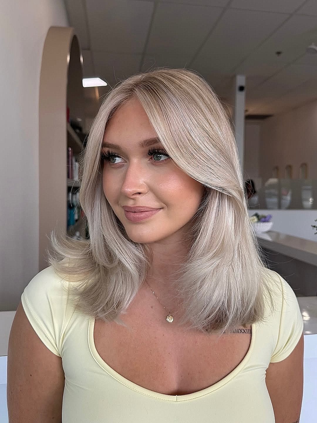 Ash Blonde Layered Lob With Curtain Bangs Ash Blonde Layered Lob With Curtain Bangs — Classy Length Hair