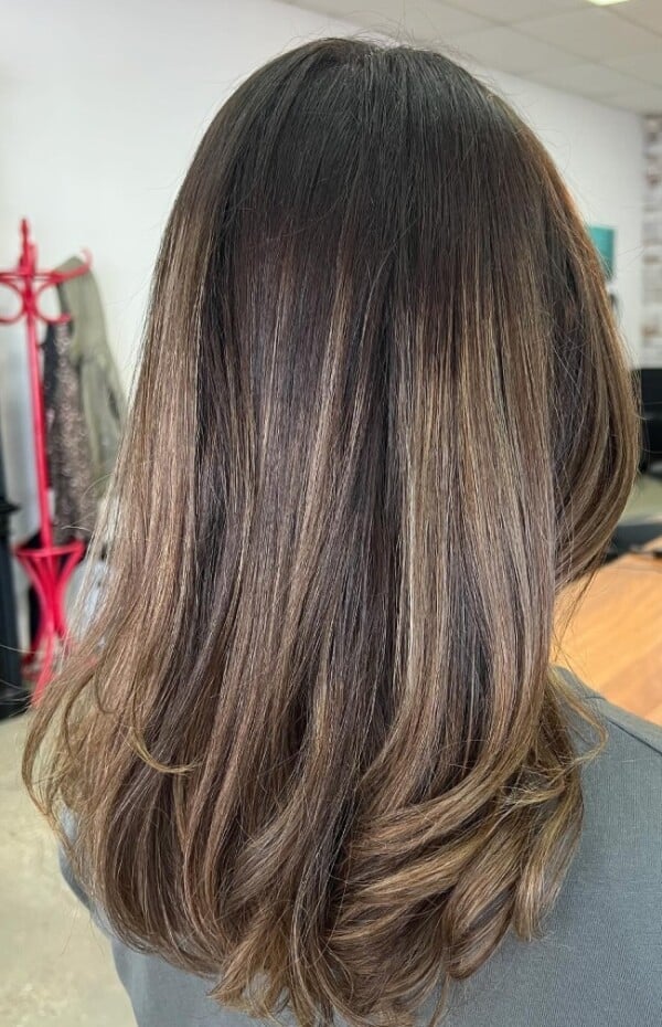 Mid-Back Natural Waves With Curtain Bangs — Classy Light Brown Balayage