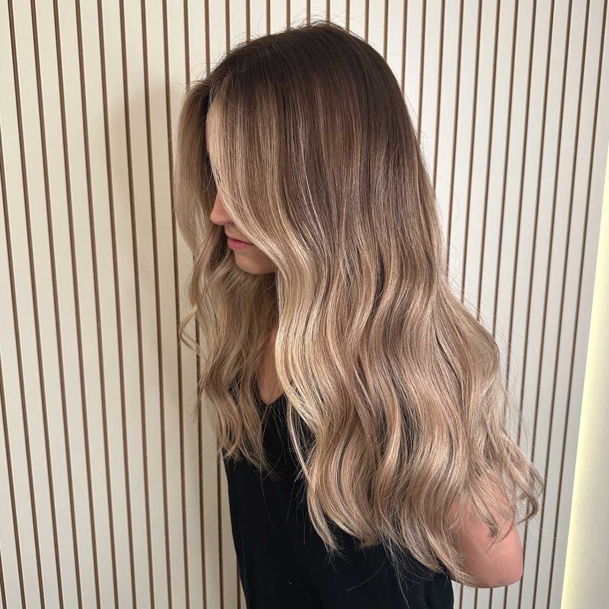 Mid-Back Balayage With Curtain Bangs — Classy Light Brown Hair with Blonde