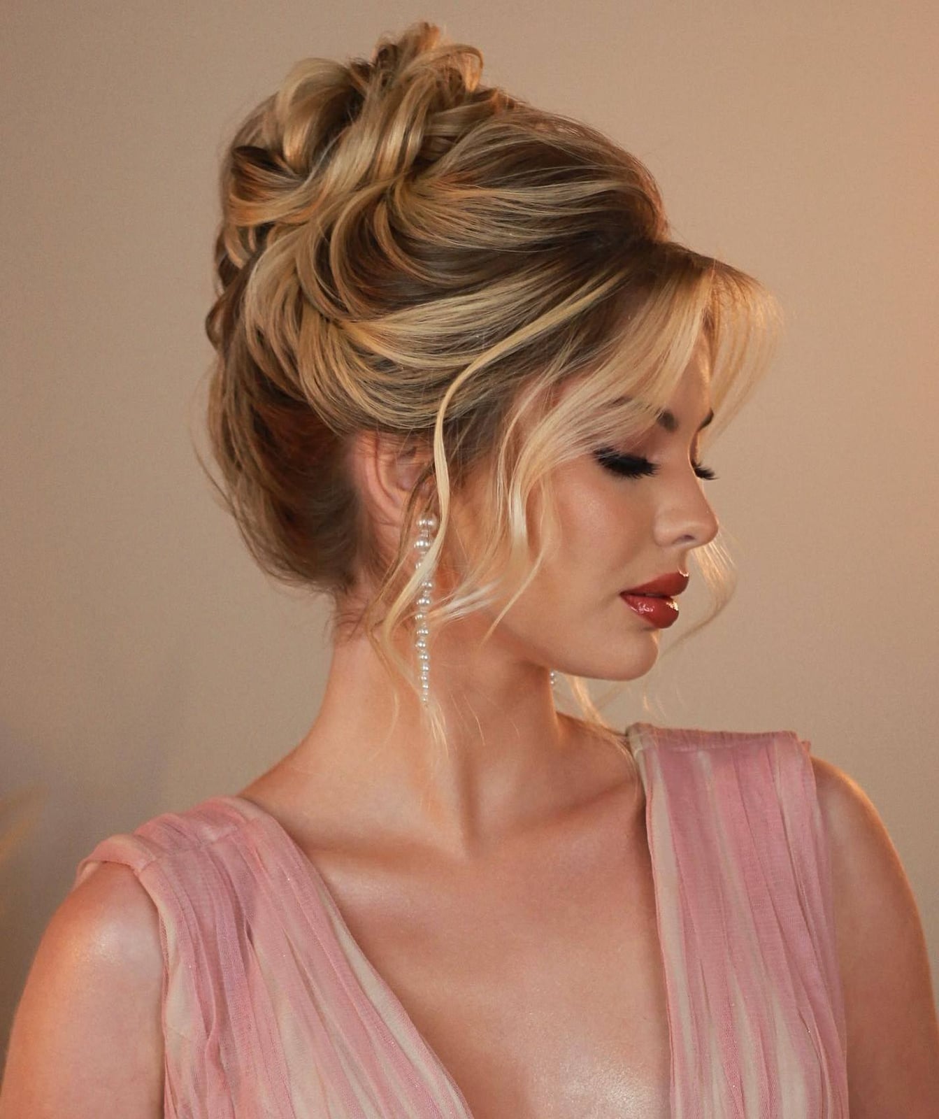 Thick Blonde Updo With Wispy Bangs Thick Blonde Updo With Wispy Bangs — Classy Loose Updo