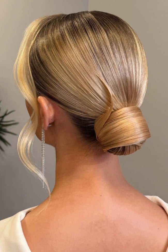 Vanilla Beige Blonde Sleek Bun With Face-Framing Pieces — Classy Low Bun Wedding Hair