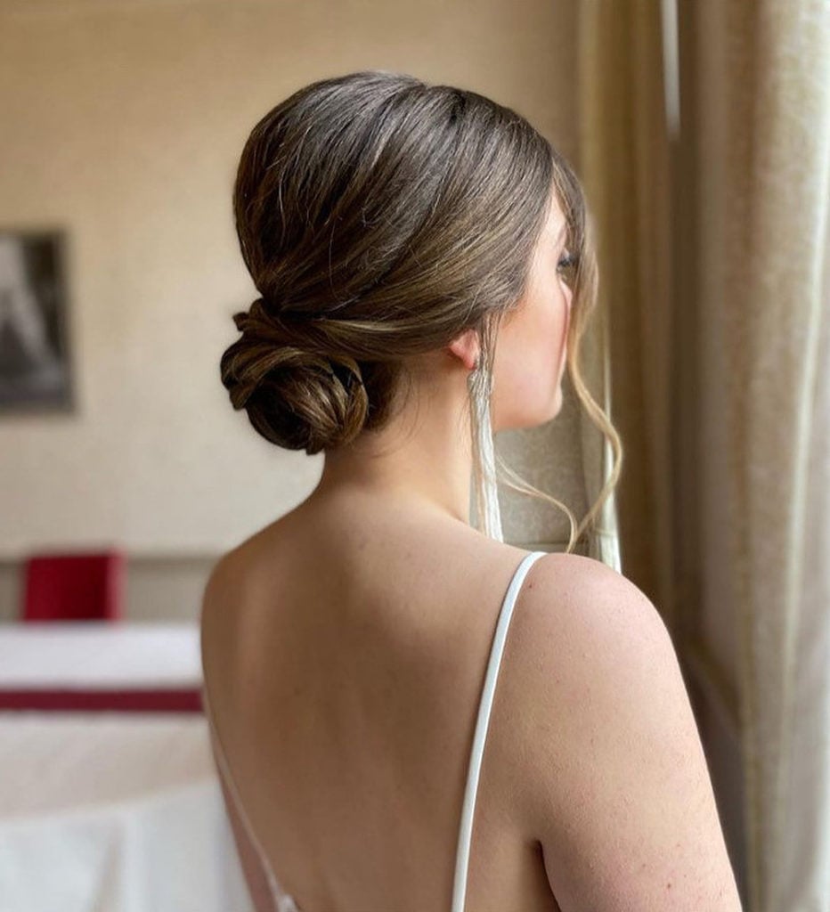 Wavy Dark Brown With Blonde Highlights Twisted Bun — Classy Low Bun Wedding Hair