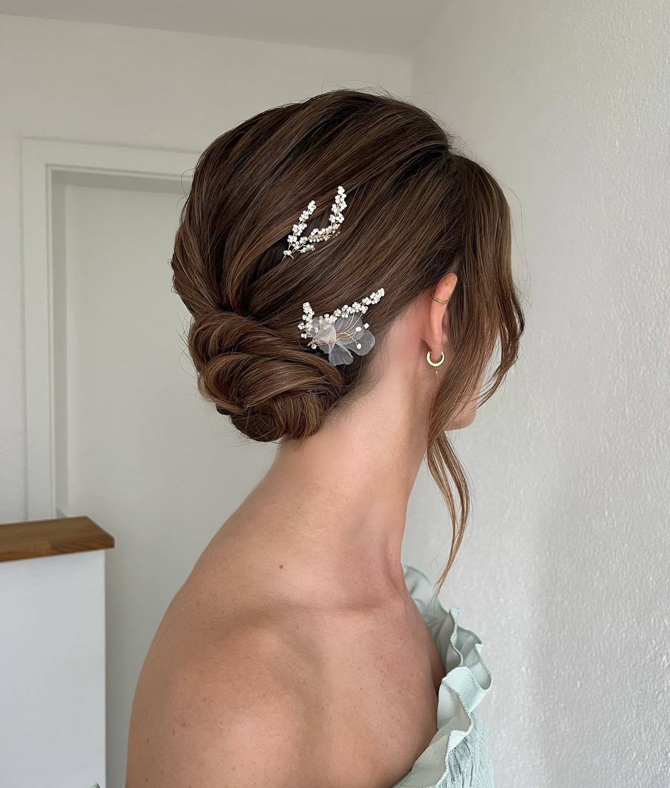 Twisted Dark Brown Wavy Bun With Decorative Pins — Classy Low Bun Wedding Hair