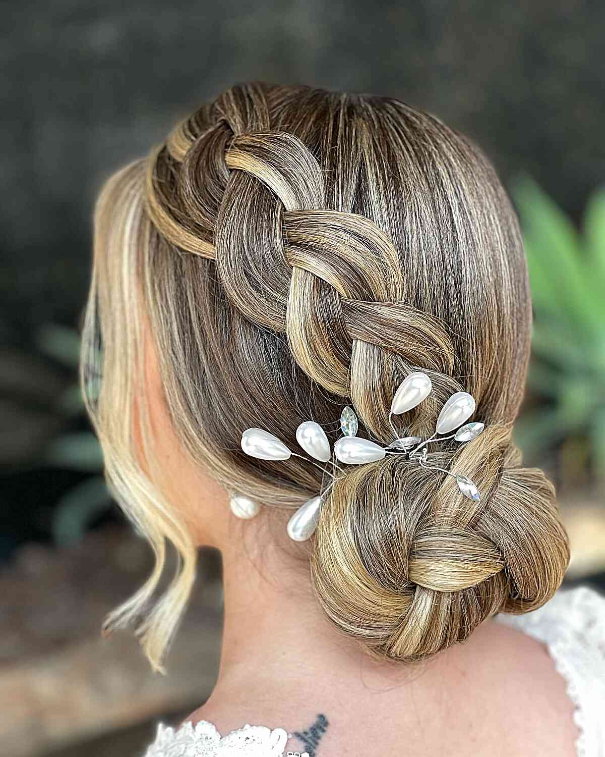 Blonde Wavy Intricate Braided Detail Bun — Classy Low Bun Wedding Hair
