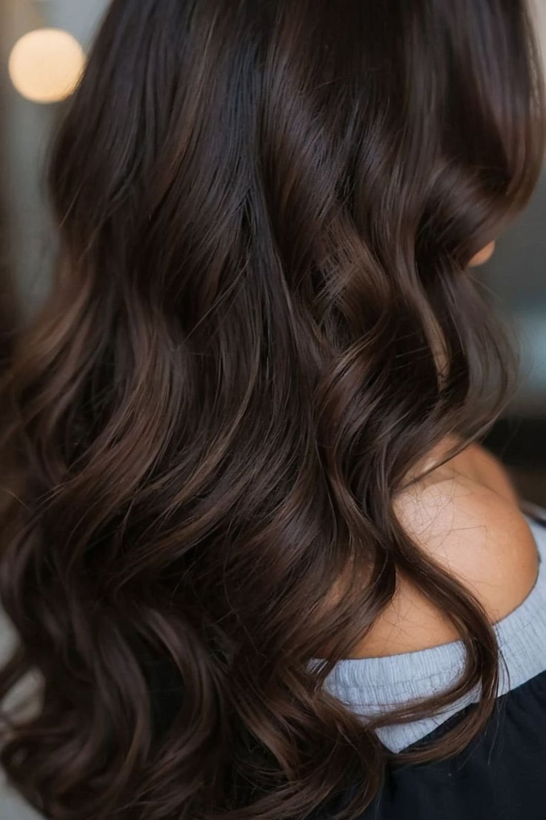 Mid-Back Dark Brown With Lighter Brown Lowlights and Curtain Bangs — Classy Lowlights for Brunettes
