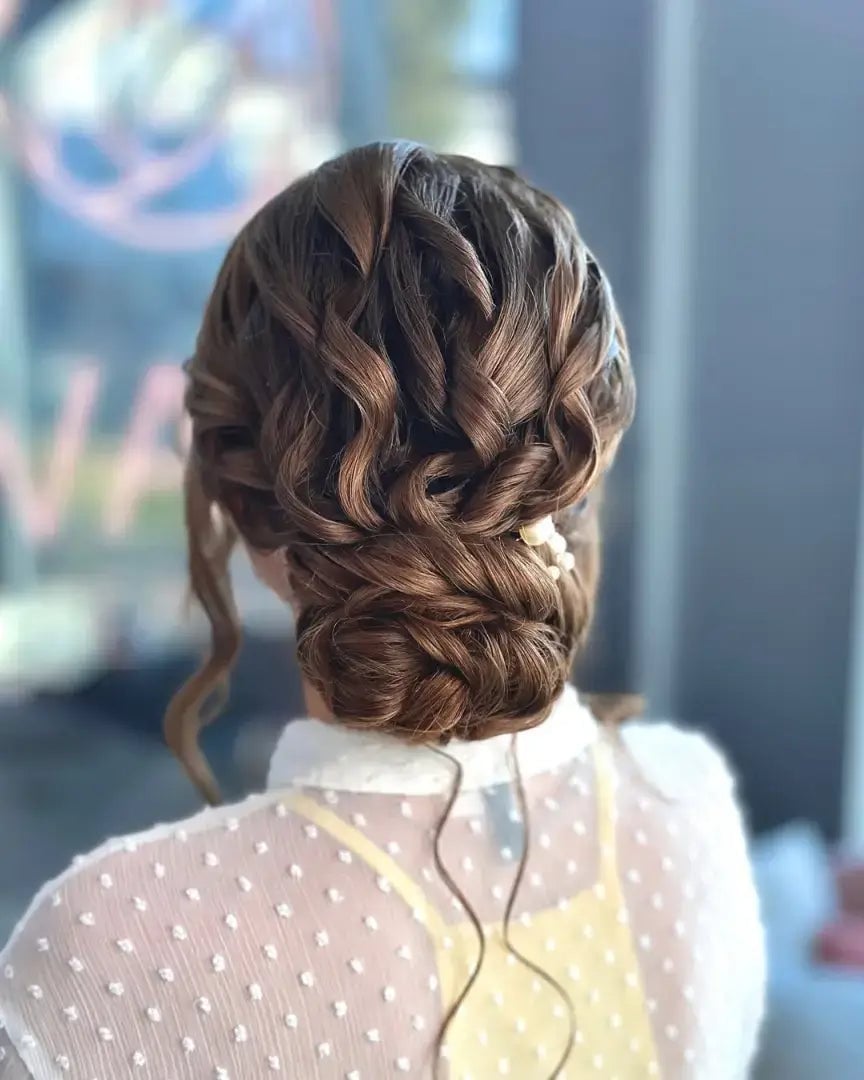 Elegant Medium Brown Twisted Low Bun Elegant Medium Brown Twisted Low Bun — Classy Messy Bun Outfit