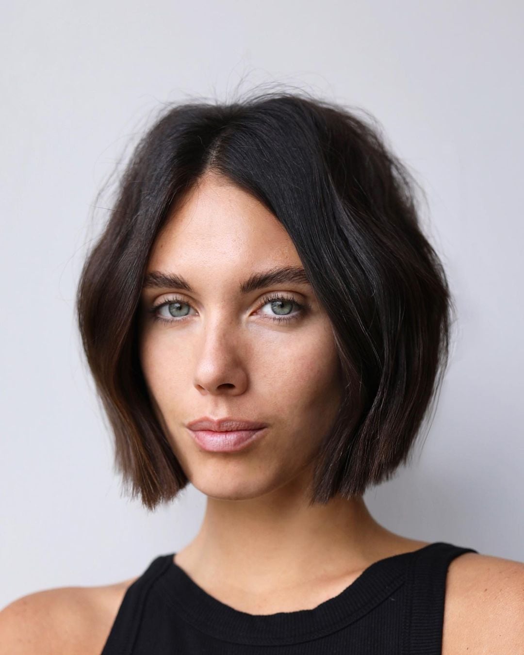 Sharp Dark Brown Bob With Air-Dried Waves and Ending At The Chin Sharp Dark Brown Bob With Air-Dried Waves and Ending At The Chin — Classy Middle Part Bob