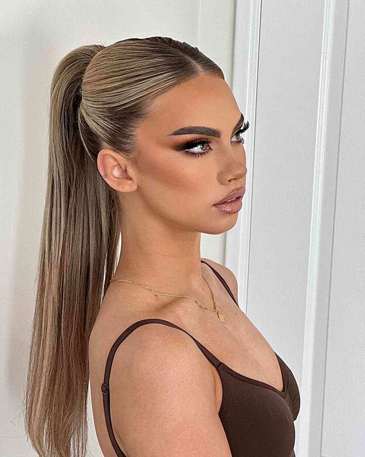 Ash Blonde Ponytail With Soft Curtain Bangs Ash Blonde Ponytail With Soft Curtain Bangs — Classy Middle Part Ponytail