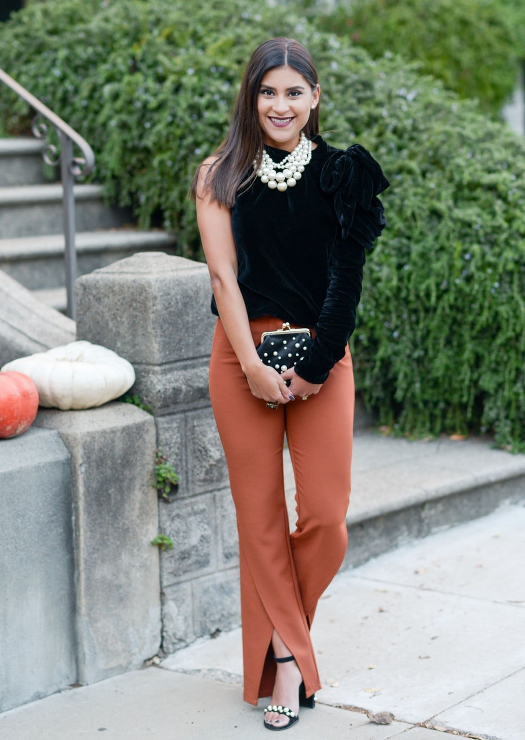 Rust Orange Split-Hem Trousers with a Black One-Shoulder Top — Classy Orange Pants Outfits
