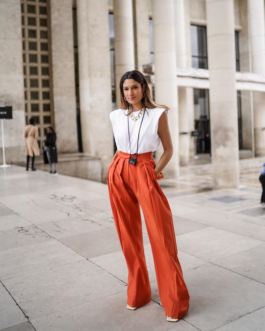 Vibrant Orange Wide-Leg Trousers with a White Sleeveless Top — Classy Orange Pants Outfits