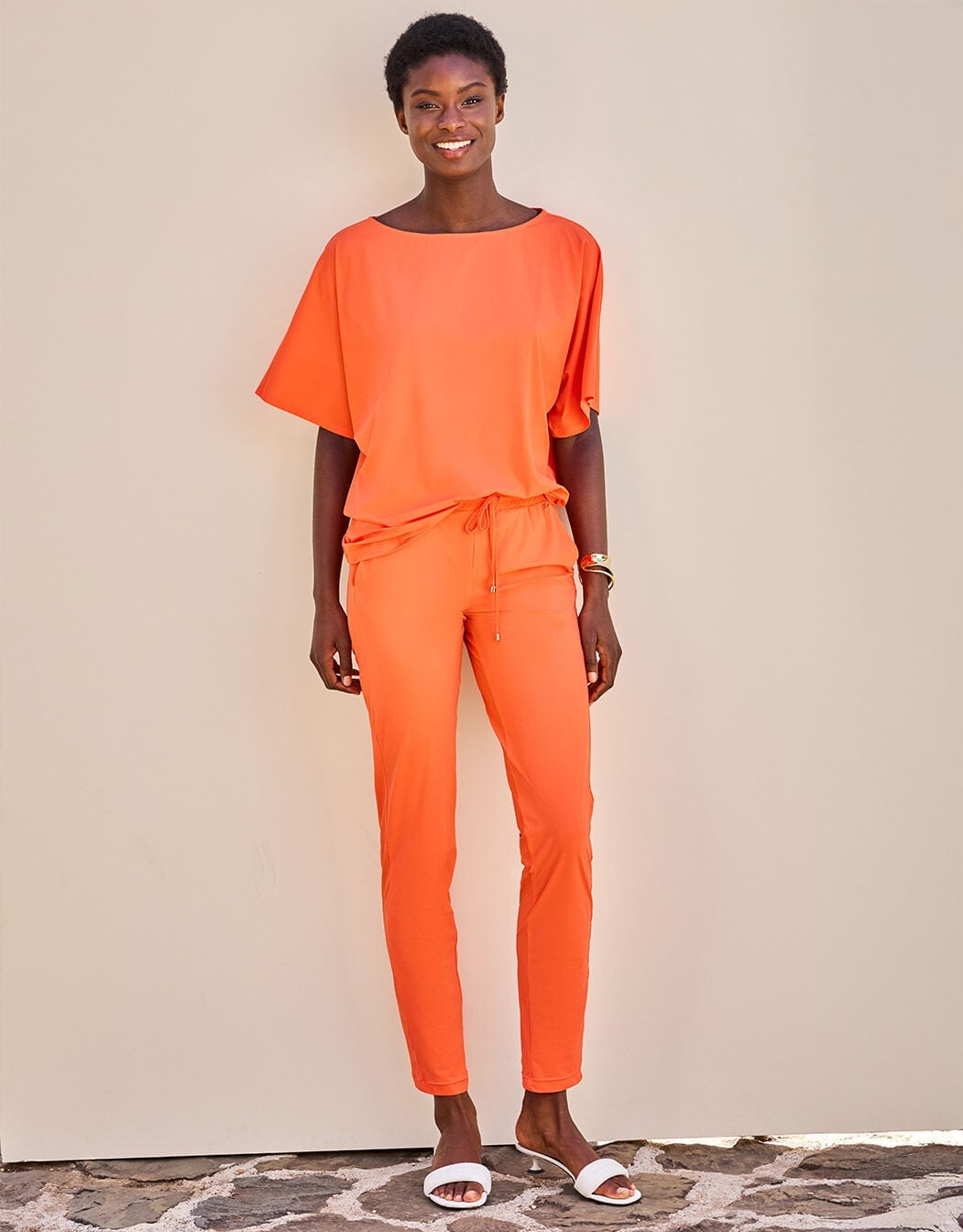 Orange Jersey Slim-Leg Pants with a Loose-Fit Top, Close-Up Take — Classy Orange Pants Outfits