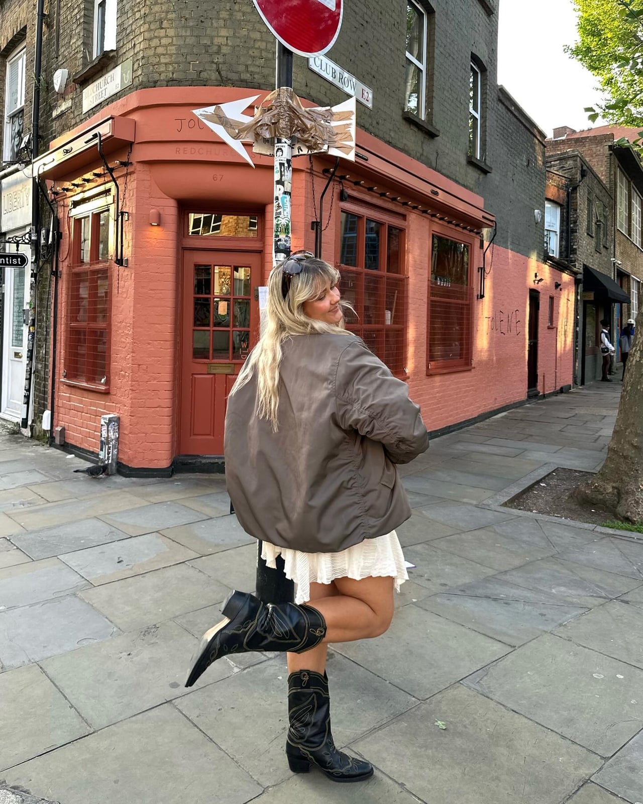 White Mini Dress With Bomber Jacket And Cowboy Boots — Classy Outfits with Cowboy Boots