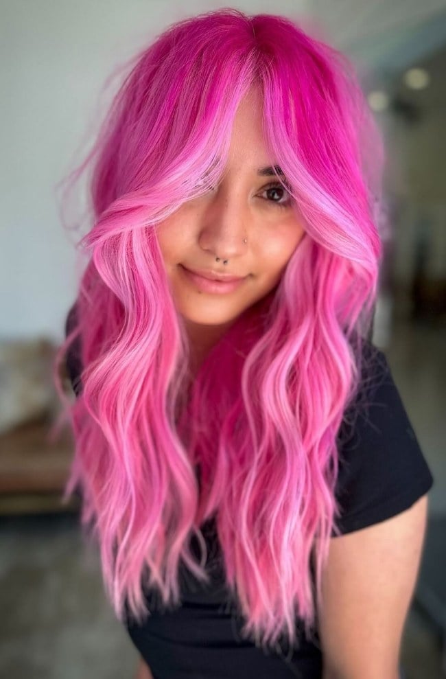 Neon Pink Face-Framing Layers With Curtain Bangs — Classy Pink Hair Color