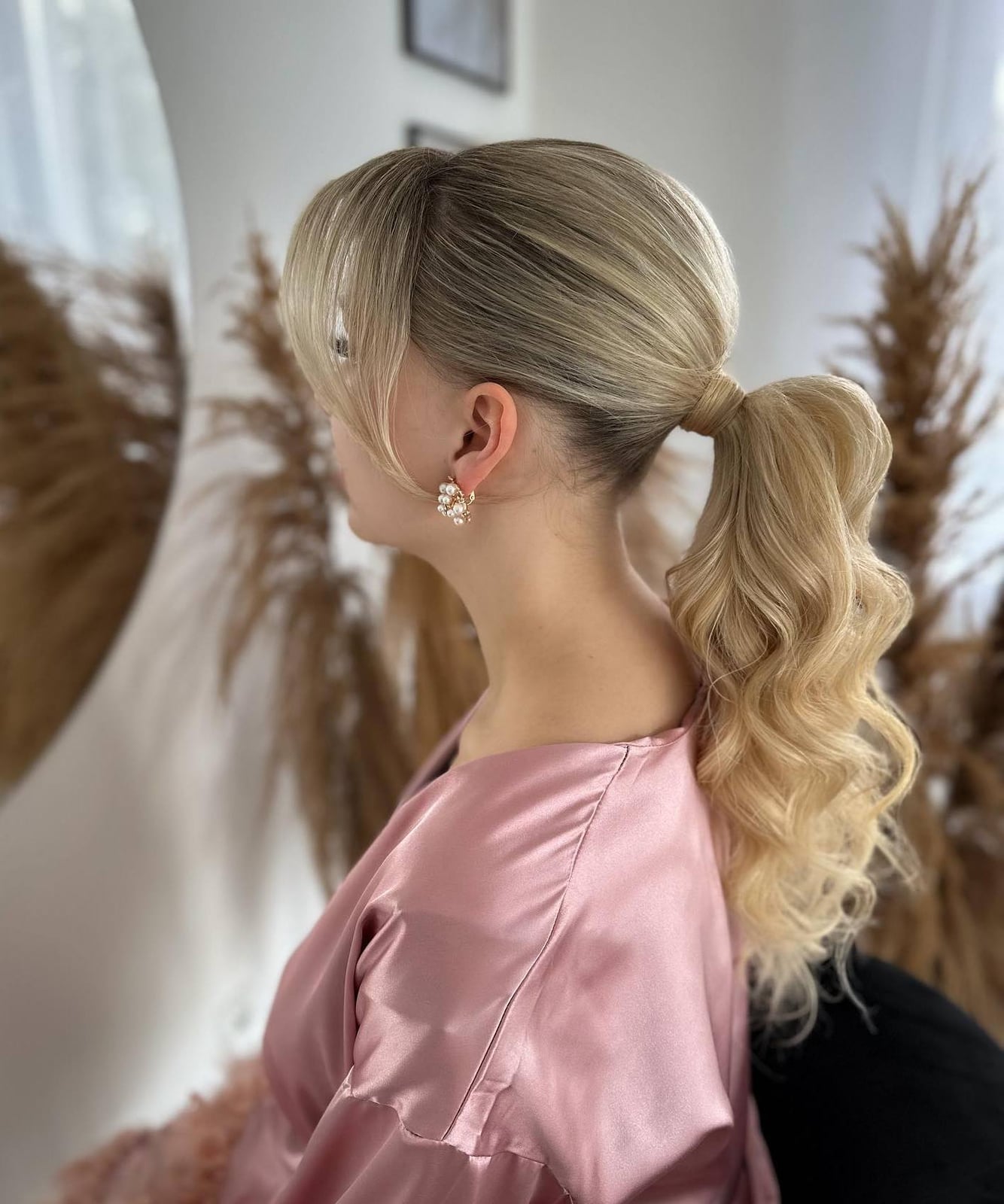 Ash Blonde Low Ponytail Curls Curtain Bangs Ash Blonde Low Ponytail Curls Curtain Bangs — Classy Ponytail with Bangs
