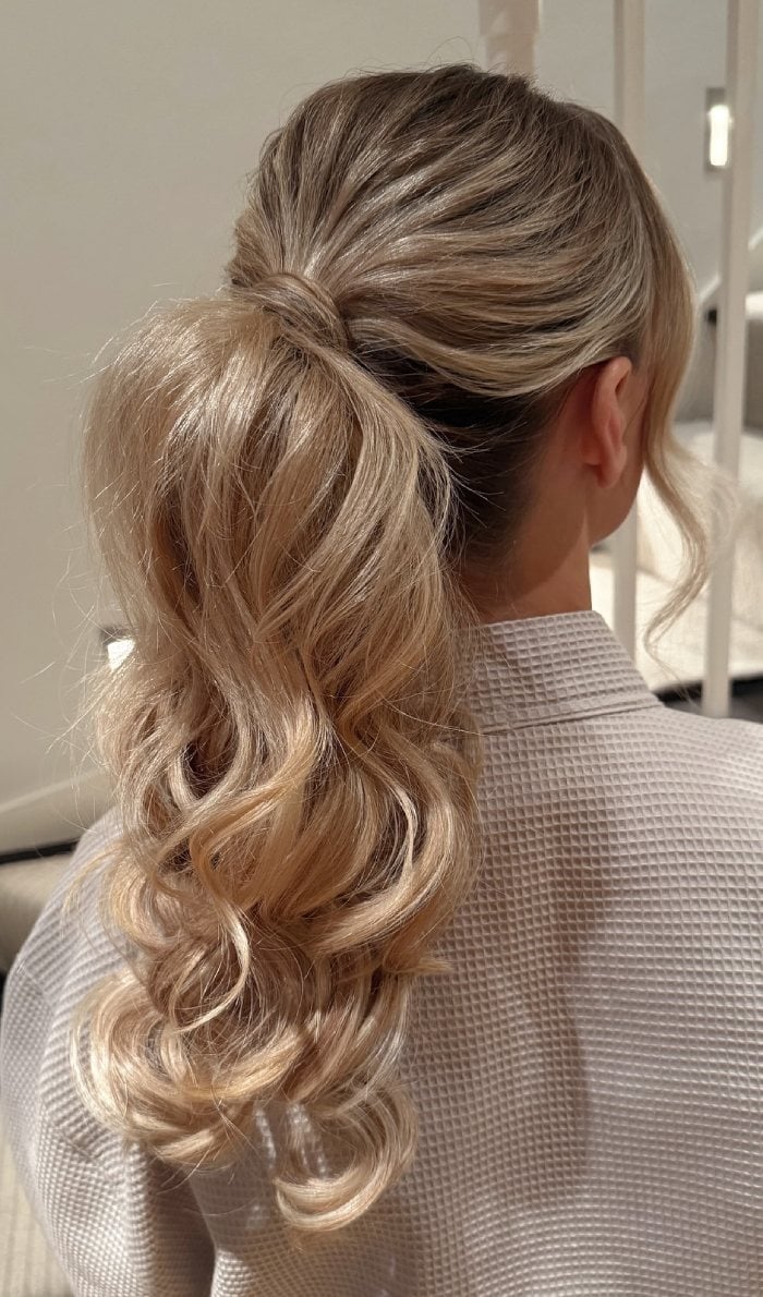Blonde Low Ponytail Voluminous Curls Blonde Low Ponytail Voluminous Curls — Classy Ponytail with Bangs