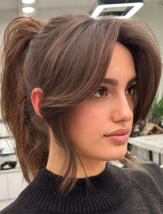 High Ponytail Voluminous Curtain Bangs High Ponytail Voluminous Curtain Bangs — Classy Ponytail with Bangs