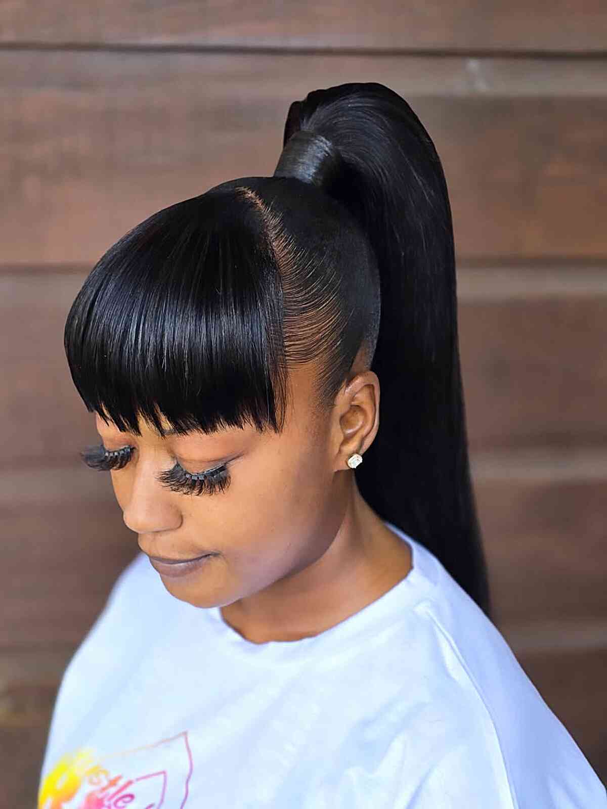 Sleek Black Ponytail With Blunt Bangs — Classy Ponytail with Swoop