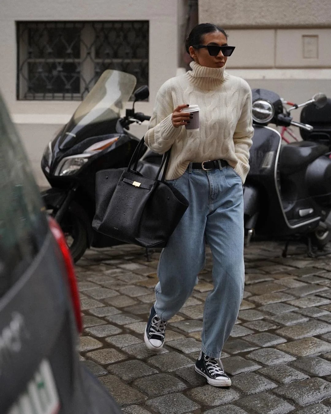 Cable Knit Sweater with Pleated Jeans and Sneakers — Classy Rainy Day Outfits