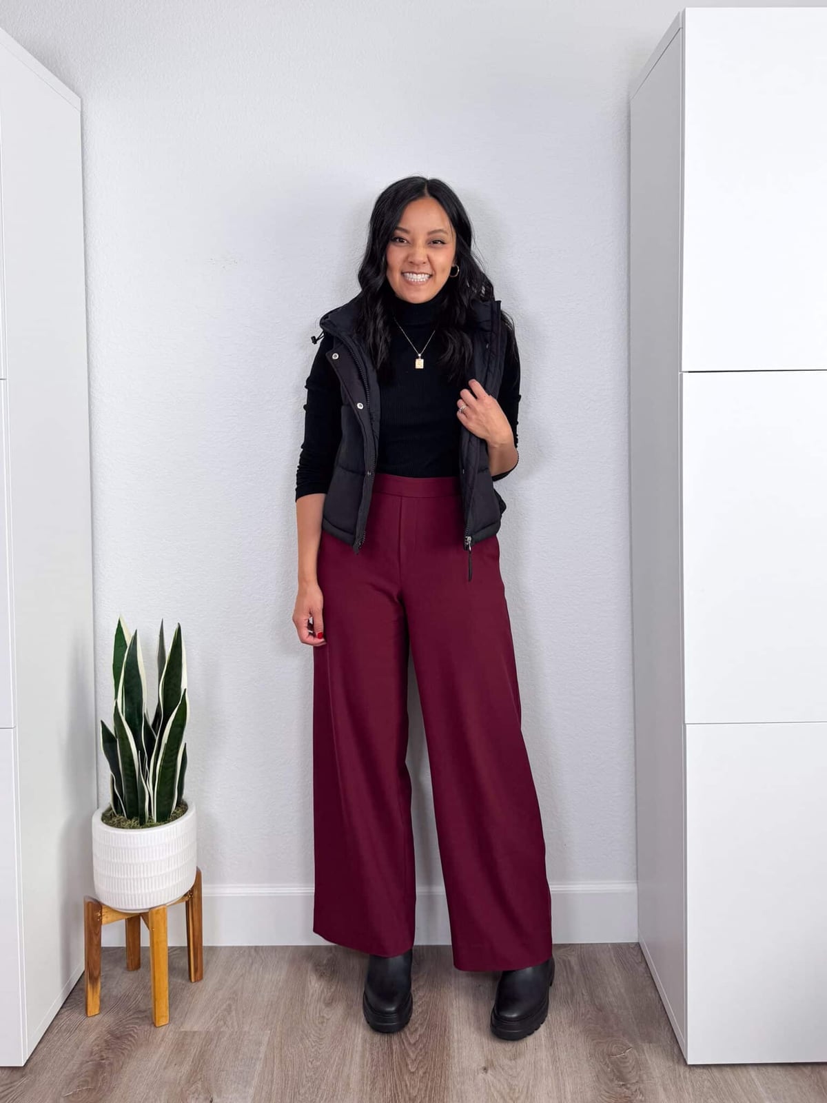 Burgundy Wide-Leg Trousers with a Black Turtleneck and Vest — Classy Red Pants Outfits