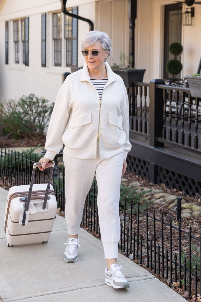 Grey and White Sneakers with a Cream Travel Set and Zip-Up Jacket Grey and White Sneakers with a Cream Travel Set and Zip-Up Jacket — Classy Sneakers Outfits