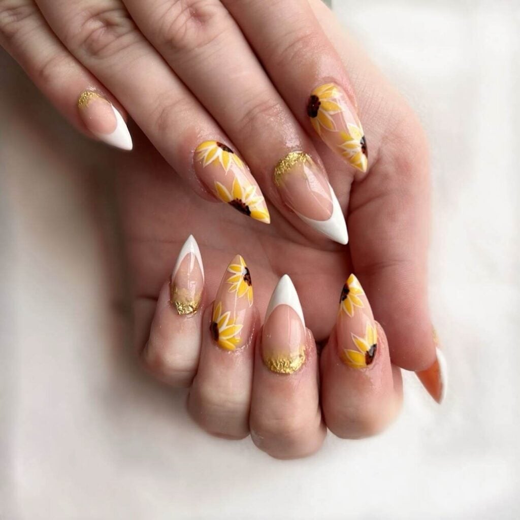 Long Stiletto White French Tips With Gold Foil Sunflowers Long Stiletto White French Tips With Gold Foil Sunflowers — Classy Sunflower Nails