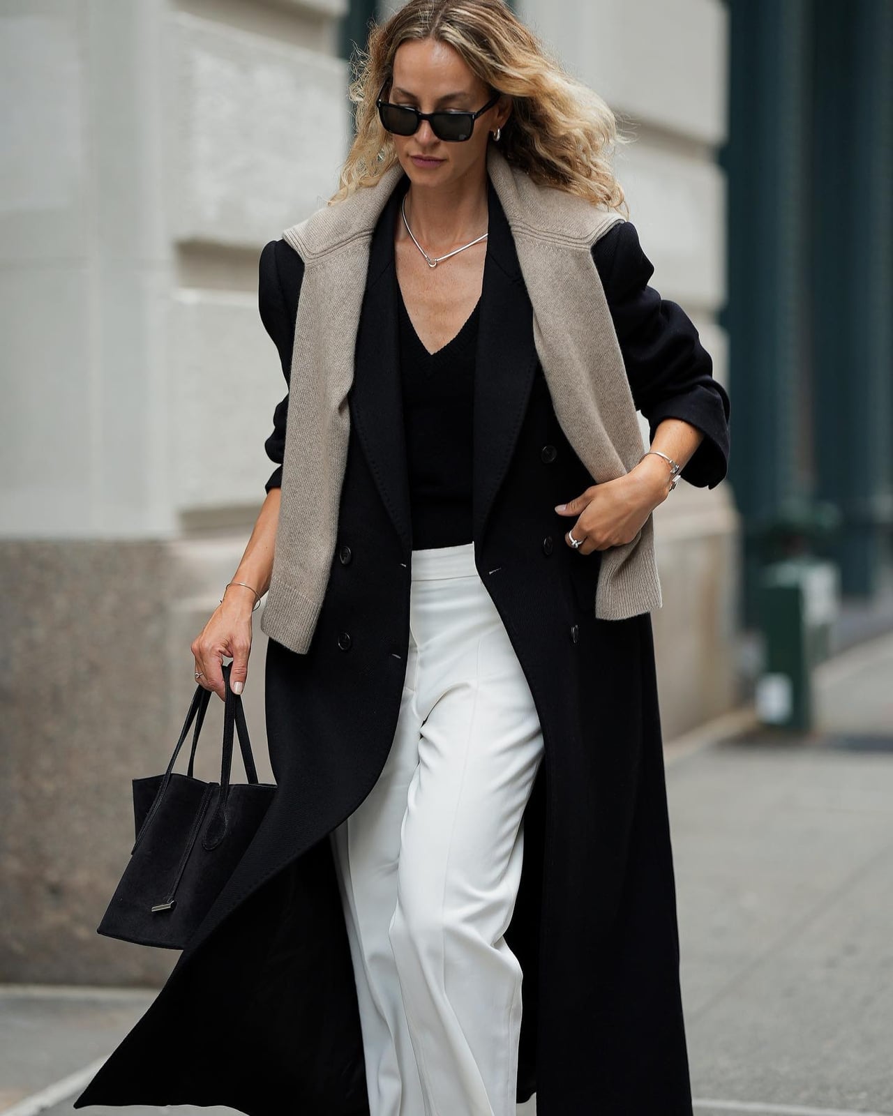 Layered Knit Vest Over a Long Coat — Classy Sweater Outfits for Women