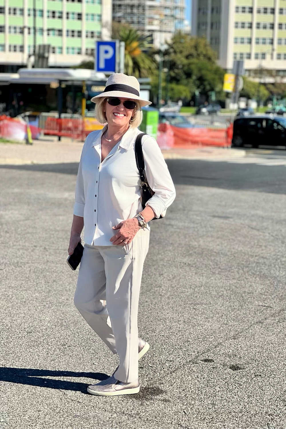 White Button-Down Shirt with Beige Trousers and Hat White Button-Down Shirt with Beige Trousers and Hat — Classy Travel Outfits