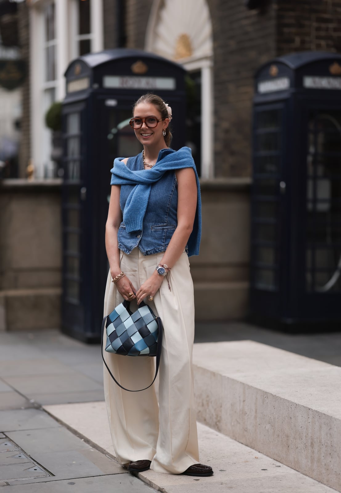 Denim Vest with Cream Wide Leg Trousers and Dark Brown Loafers Denim Vest with Cream Wide Leg Trousers and Dark Brown Loafers — Classy Travel Outfits