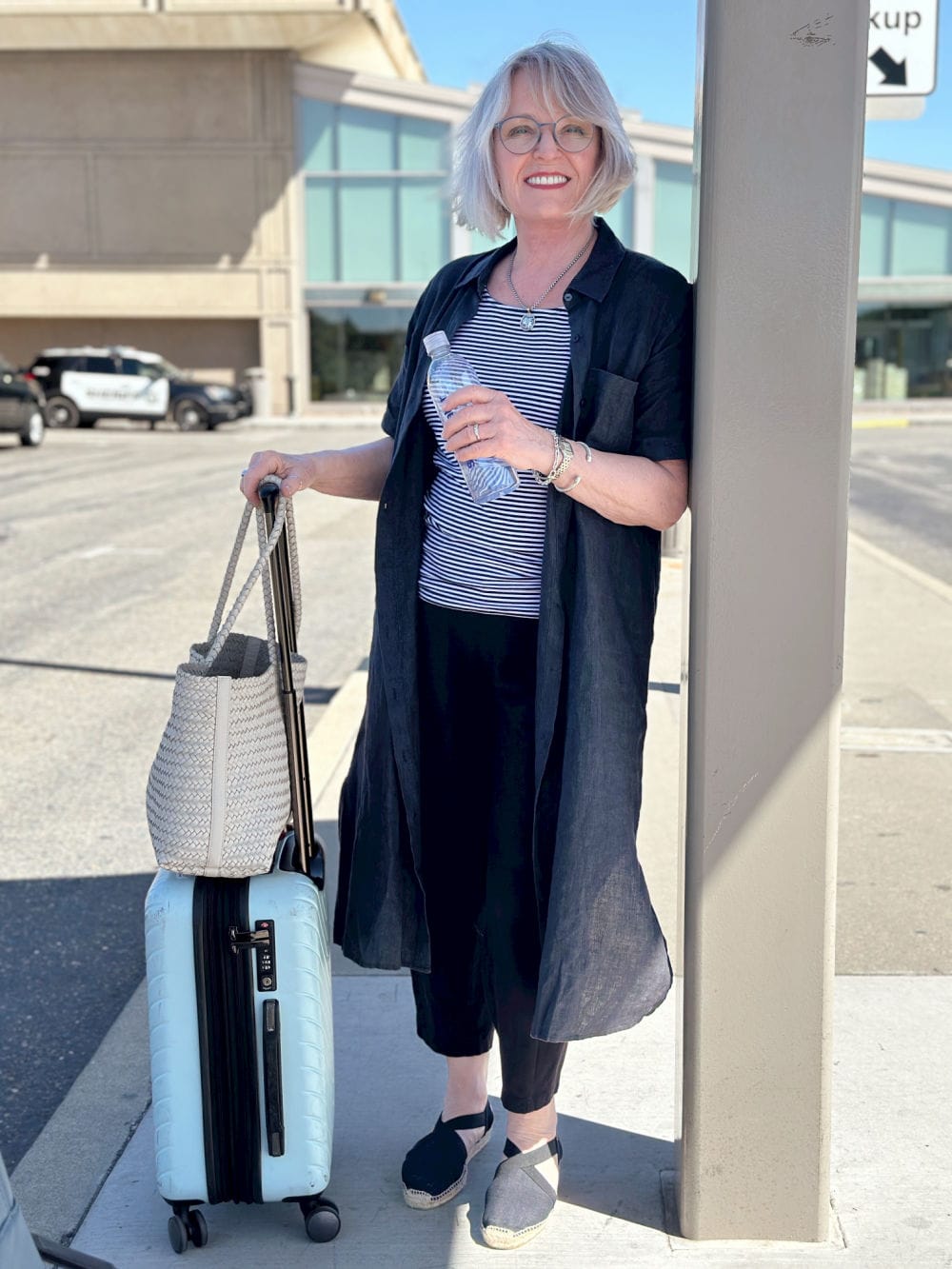 Duster Jacket with Cropped Trousers and Espadrilles and Woven Tote Bag Duster Jacket with Cropped Trousers and Espadrilles and Woven Tote Bag — Classy Travel Outfits