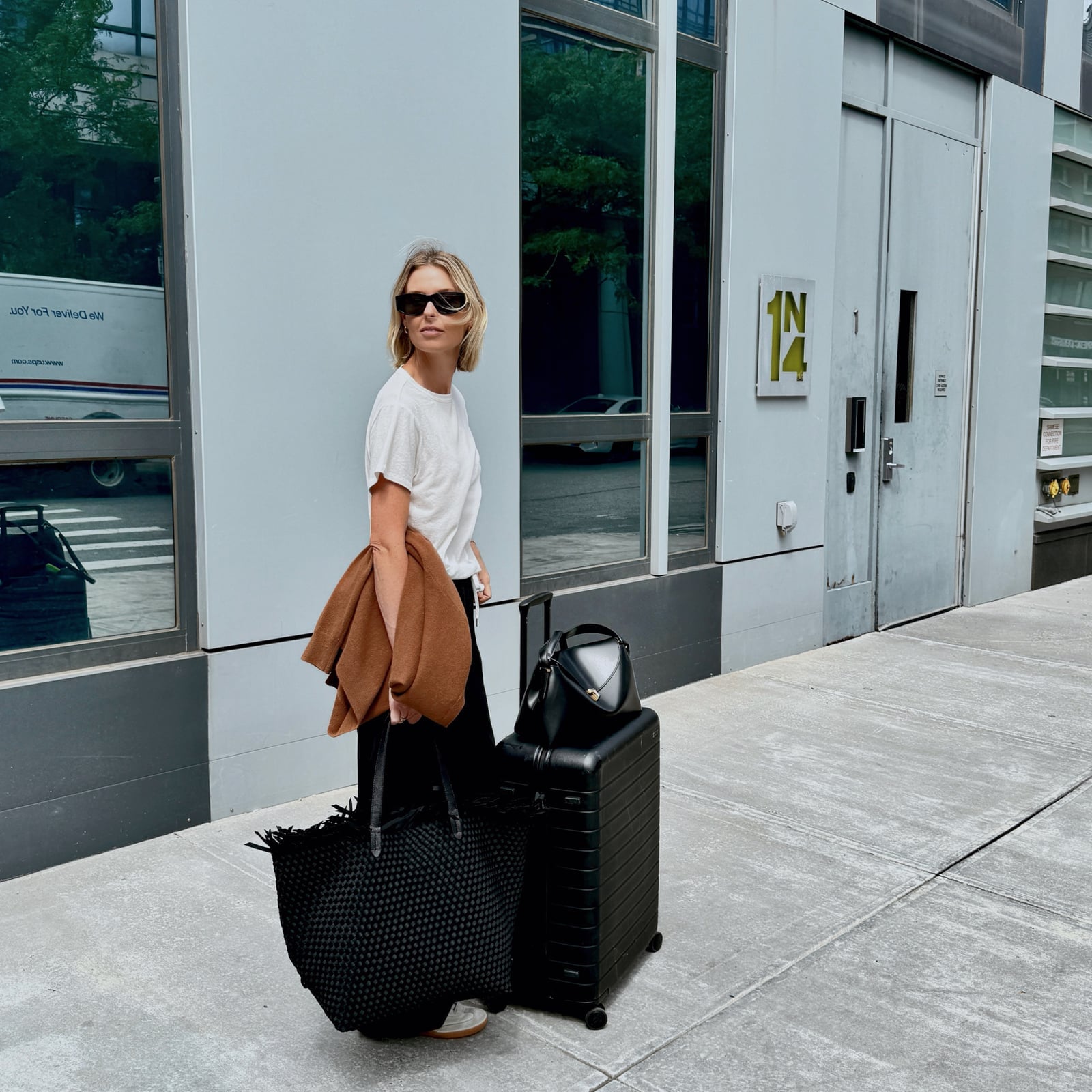 Brown Cardigan Over T-Shirt and Relaxed Trousers Brown Cardigan Over T-Shirt and Relaxed Trousers — Classy Travel Outfits