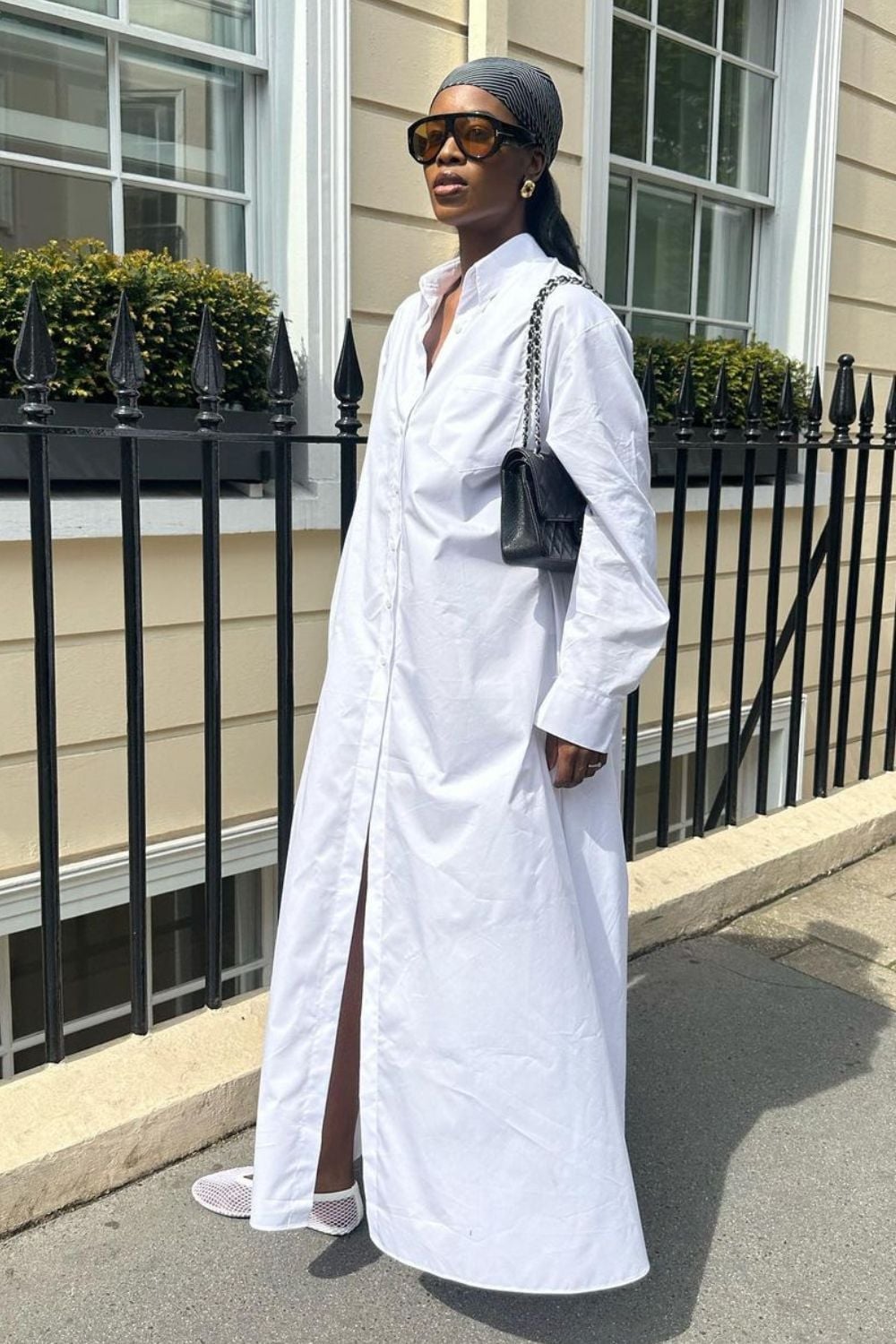 An Oversized White Shirt Dress With High Slit An Oversized White Shirt Dress With High Slit — Classy White Outfits