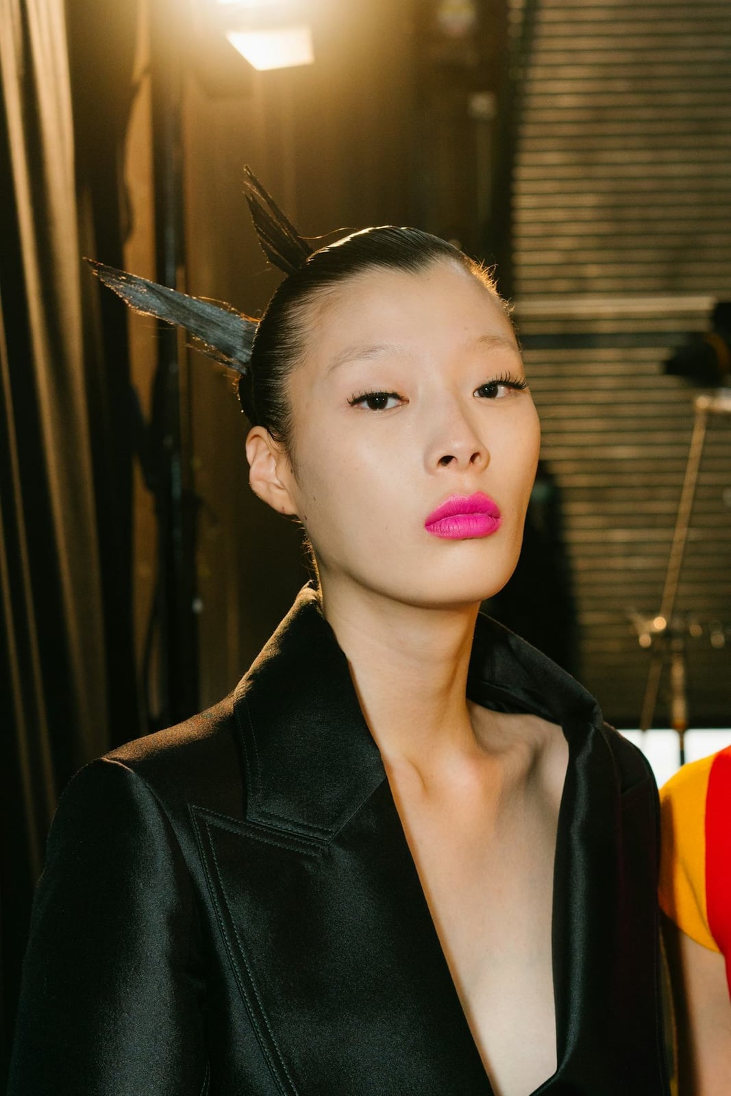 Sleek Black Spiky Topknot With Wet-Look Finish — Classy Y2K Updo
