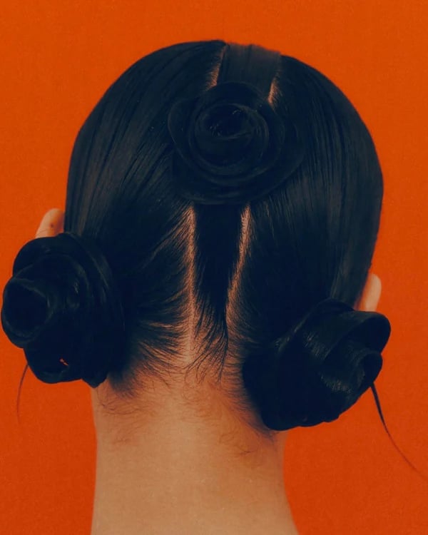 Classic Dark Brown Updo With Rose Accents — Classy Y2K Updo
