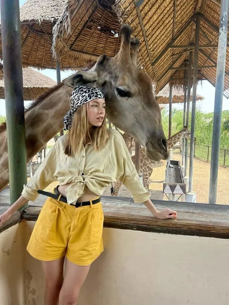 Pale Yellow Linen Shirt Tied Over Beige Shorts Pale Yellow Linen Shirt Tied Over Beige Shorts — Classy Zoo Outfits
