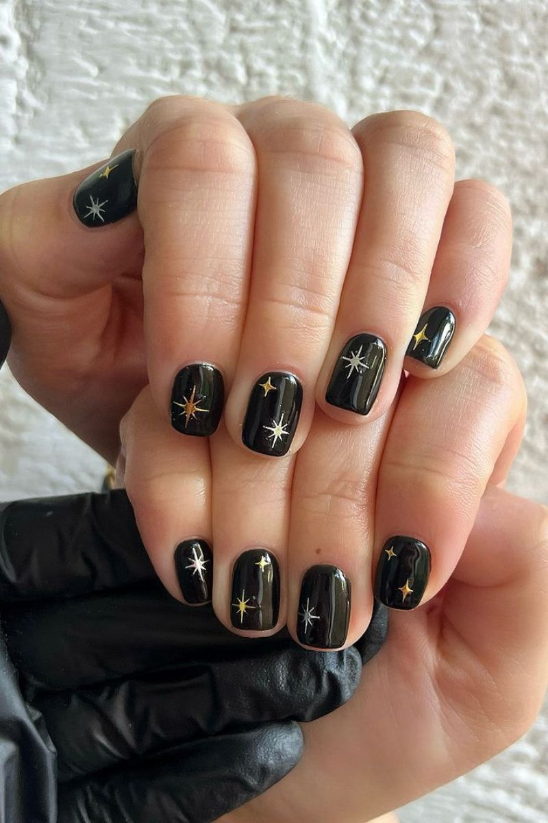Short Almond Glossy Black with Gold and Silver Stars Short Almond Glossy Black with Gold and Silver Stars — Cute Black Nails