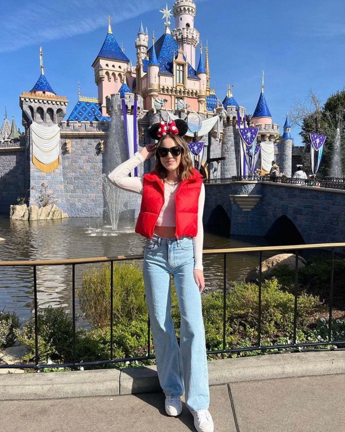 Puffer Vest Over Long Sleeve Shirt With Wide Leg Jeans — Cute Disney Outfit Inspo