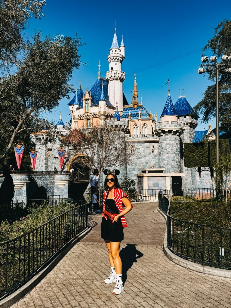 Striped Jacket Over Black Romper With Mickey Ears — Cute Disney Outfit Inspo