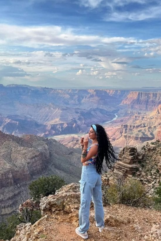 Floral Crop Top and Cargo Jeans with Sneakers — Cute Hiking Outfit Inspo