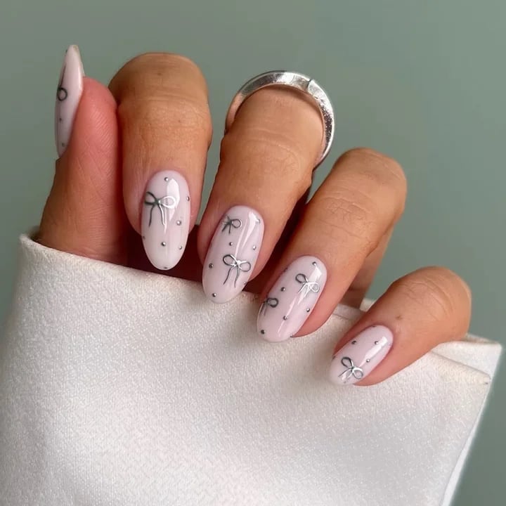Sheer Pink Medium Almond with Silver Bows and Dots — Cute Medium Nails