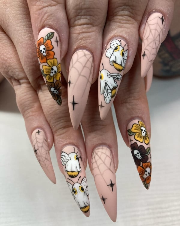 Long Stiletto Nude Nails With Floral Skulls Long Stiletto Nude Nails With Floral Skulls — Cute Skull Nails