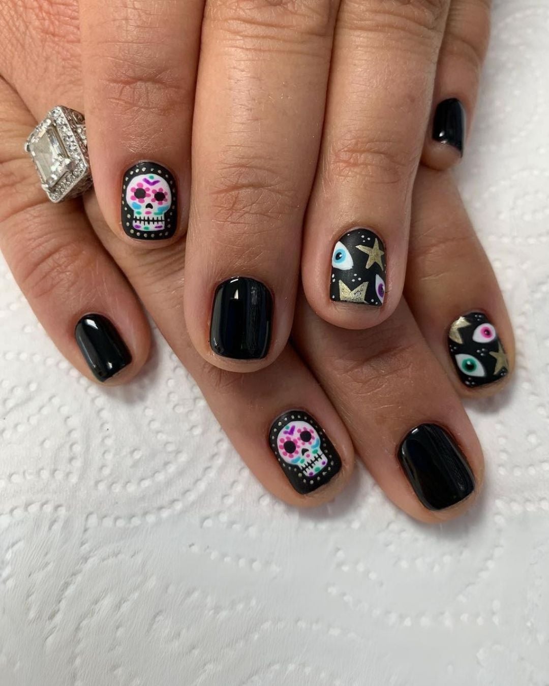 Short Almond Black Nails With Colorful Skulls Short Almond Black Nails With Colorful Skulls — Cute Skull Nails
